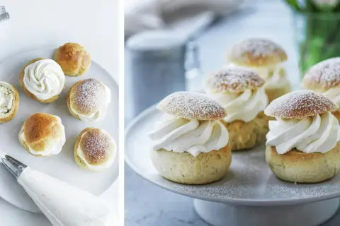 Färdigbakade semlor med fluffig grädde och pudrat florsocker. En härlig syn för alla som älskar att baka semlor!